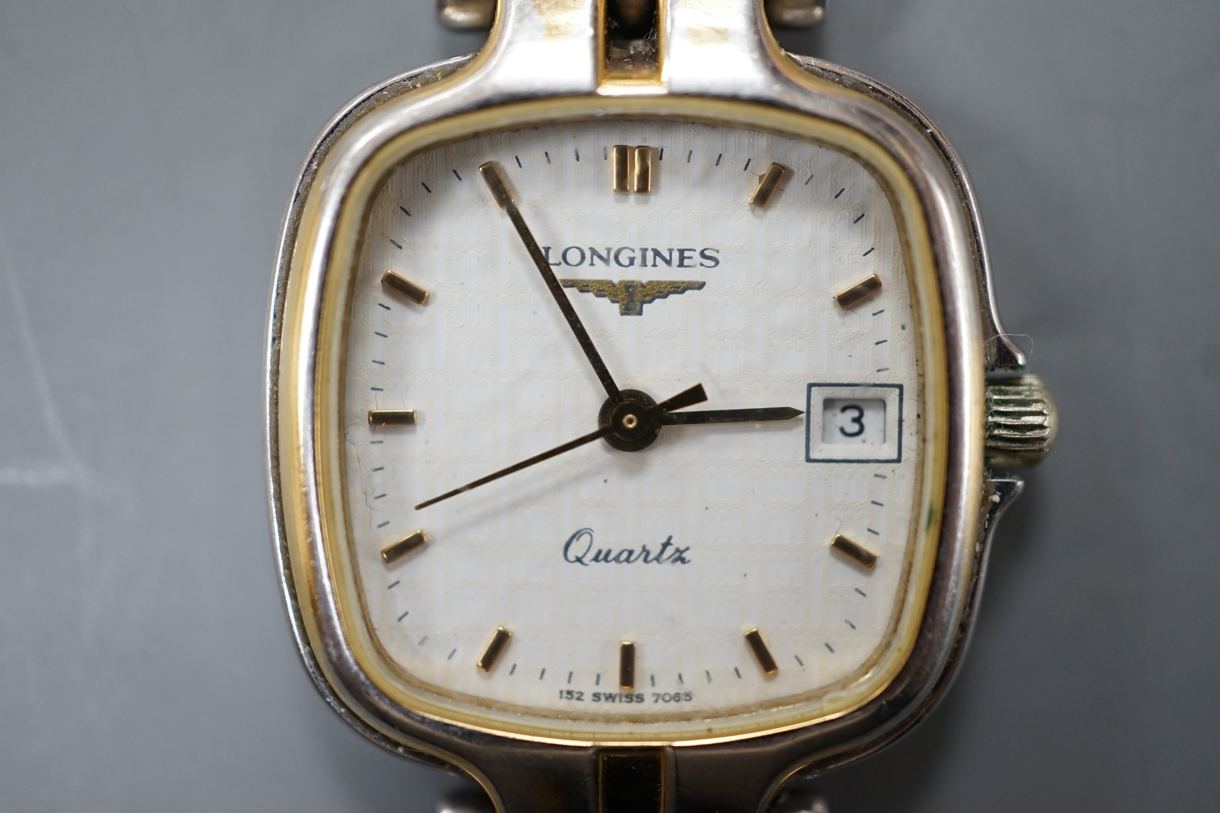 A lady's modern steel and gold plated Longines quartz wrist watch, on a steel and gold plated Longines bracelet.